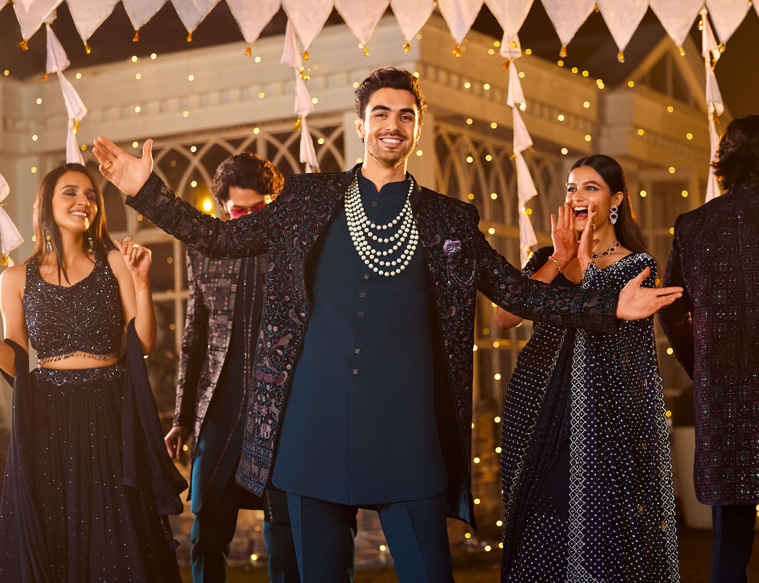 Groom wearing modern indo western sherwani for wedding reception